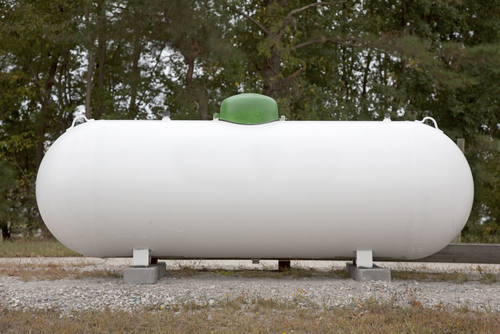Large 400 Pound Propane Tank in the Yard of a Rural Home Stock